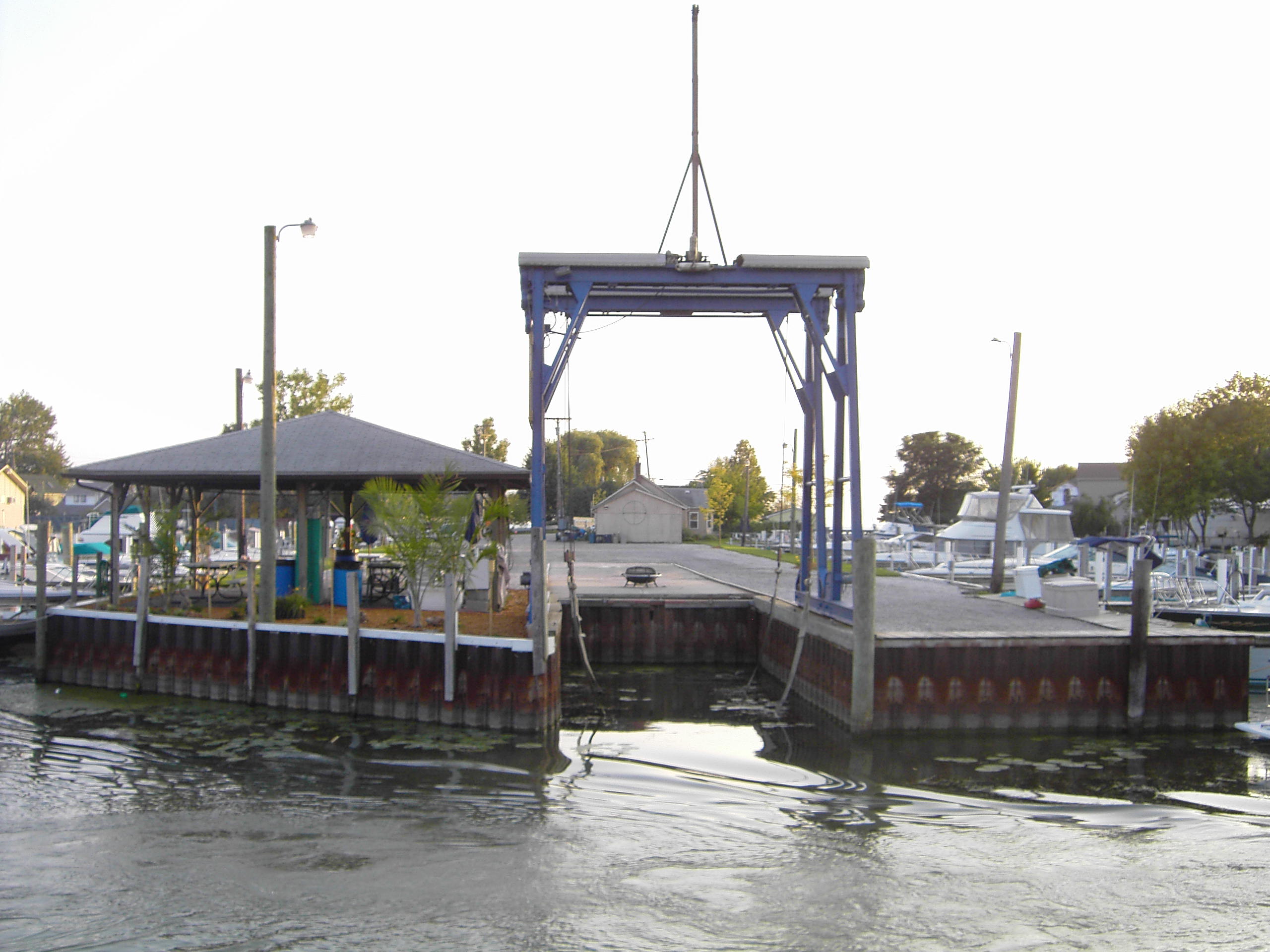 Picture of boat wells for rent and boat hoist for winter storage or haulouts at Swan Creek Harbor in Lake St. Clair